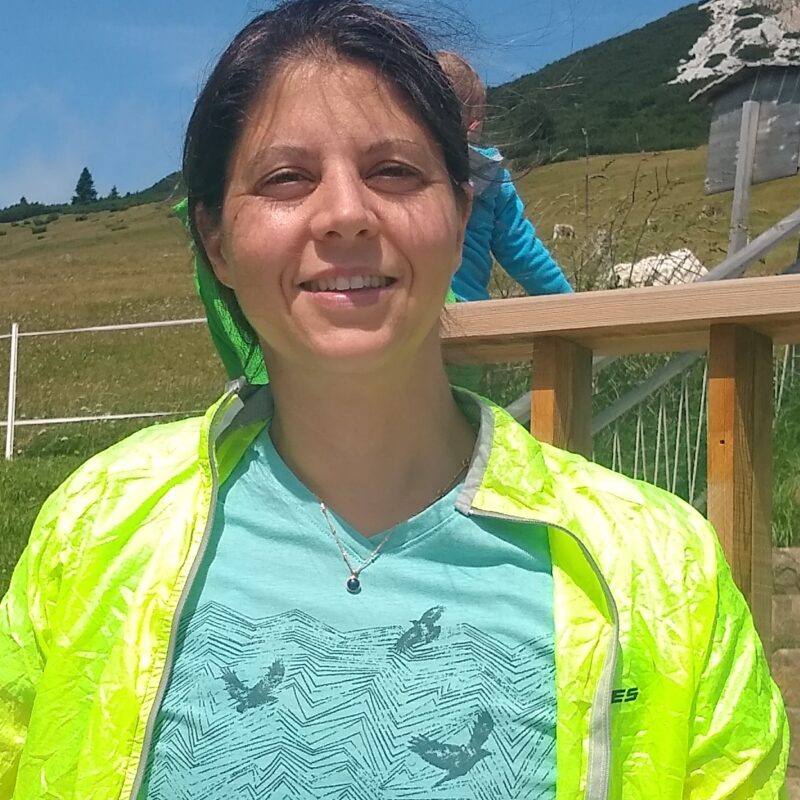 A photo of a woman wearing a high visibility jacket