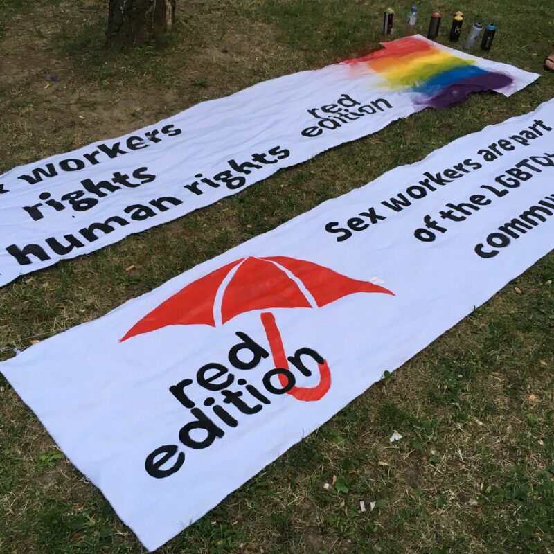 A photo red edition banner on the ground